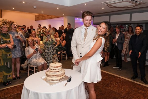 the angel hotel wedding wedding venue in hampshire couple cutting cake