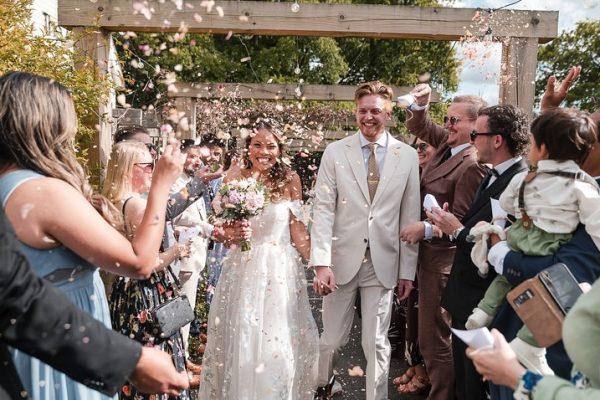 the angel hotel wedding wedding venue in hampshire couple with confetti